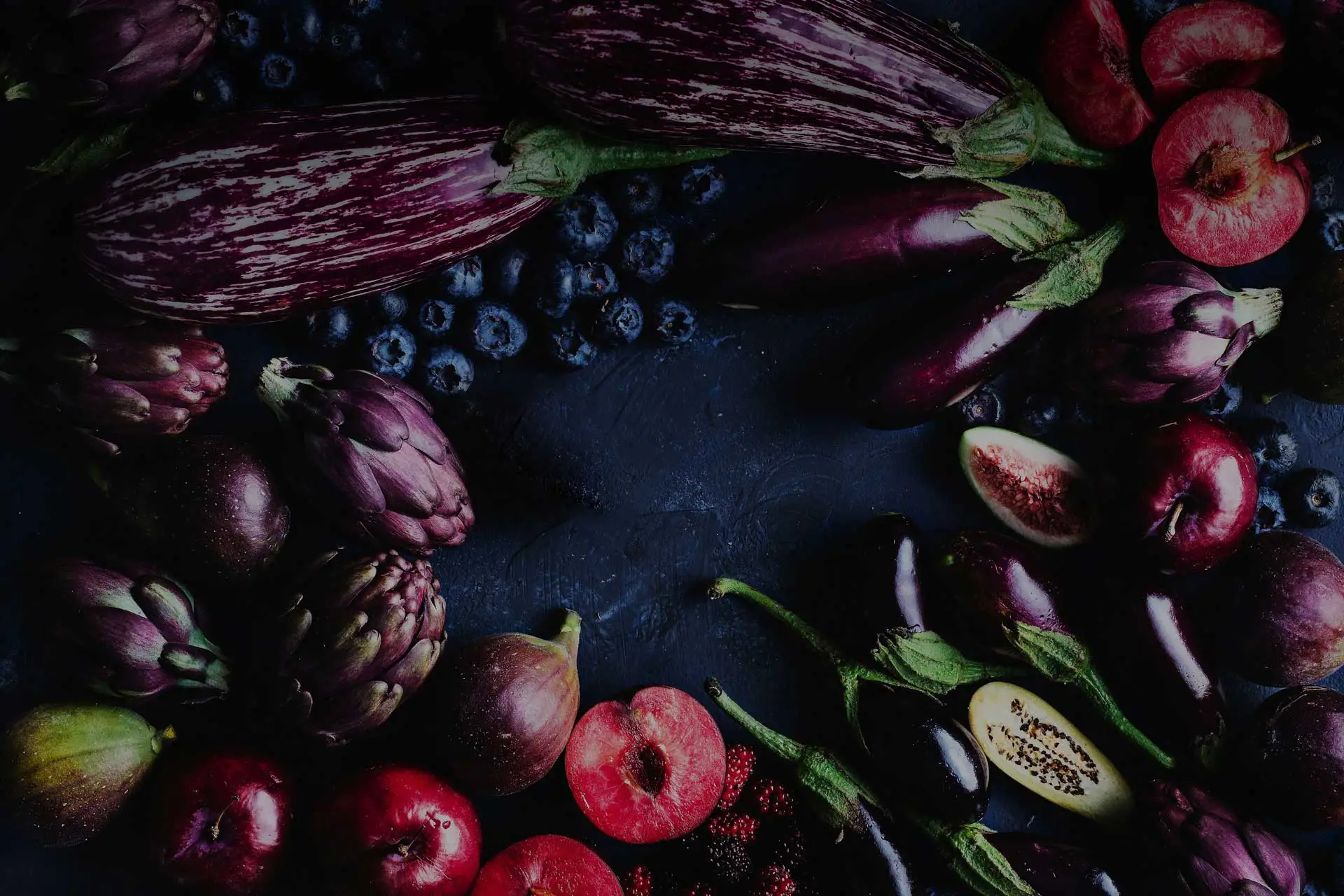 fresh fruits and vegetables on a dark background