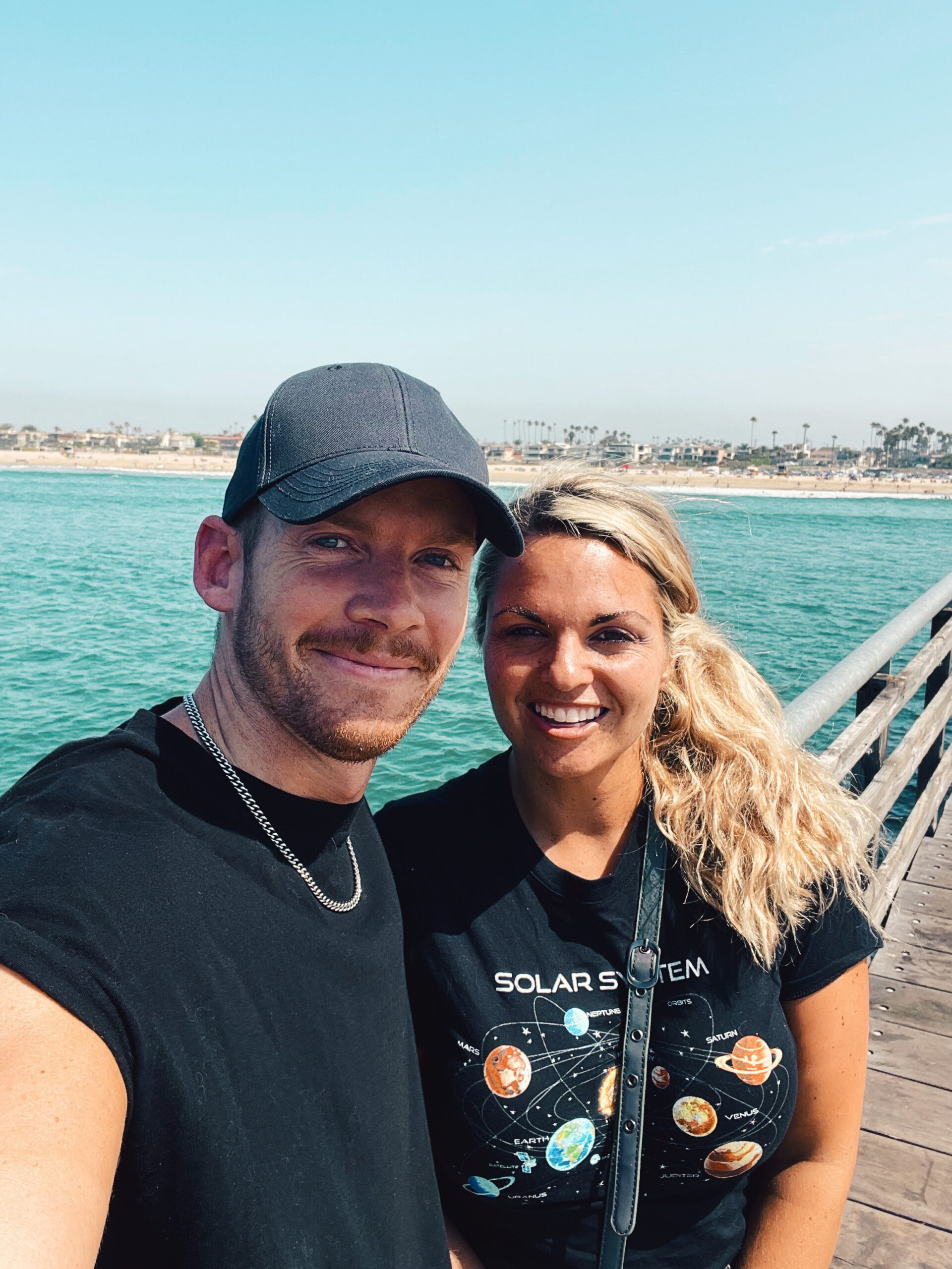 Couple on pier near ocean