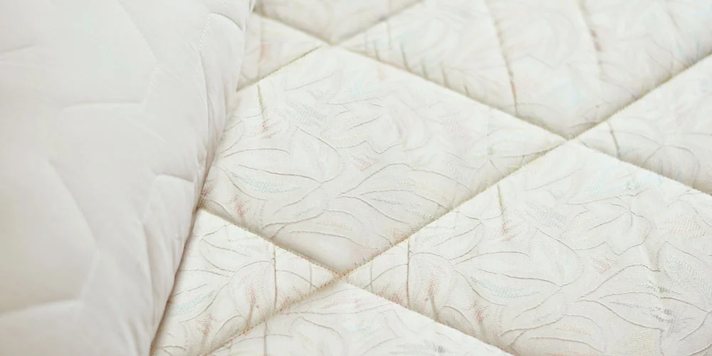 close up of mattress and pillow